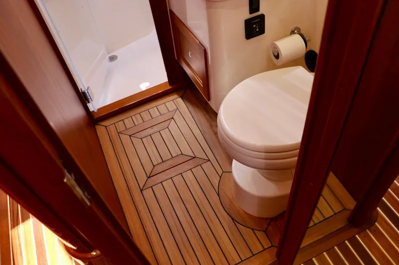 Slide: The Image of Luxury bathroom on 2026 Hinckley Talaria 48 MKII yacht with wooden flooring. - 20