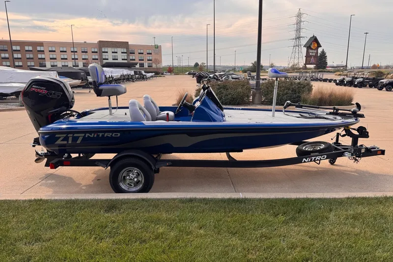 Slide: The Image of 2026 Nitro Z17 boat with Mercury Pro XS engine, parked outdoors. - 2