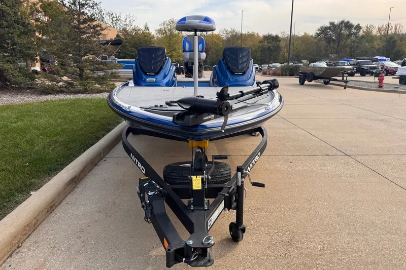 Slide: The Image of 2026 Nitro Z17 boat on trailer, parked outdoors, showcasing sleek design and modern features. - 3