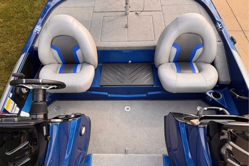 Slide: The Image of The image shows the cockpit of a blue Nitro Z17 boat with two gray seats. - 8