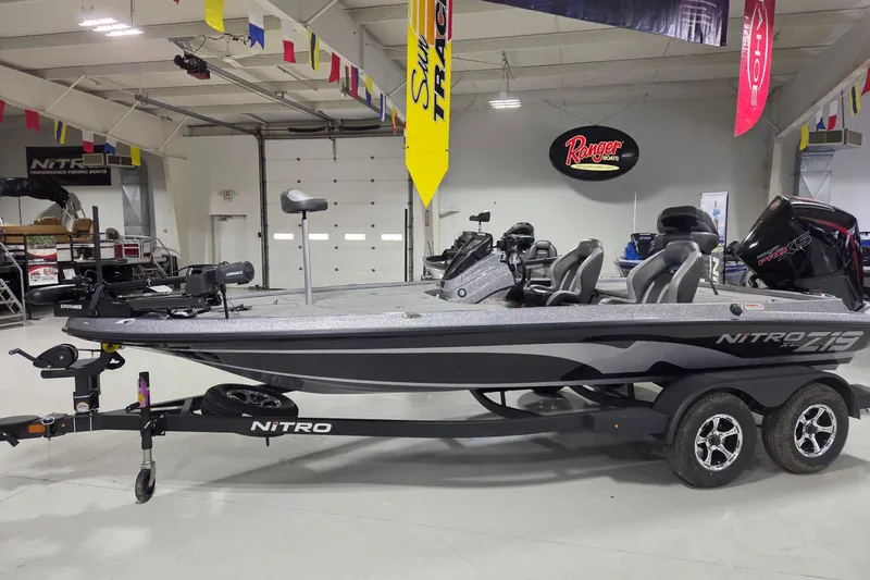 The Image of 2026 Nitro Z19 XL boat in showroom with trailer. - 0