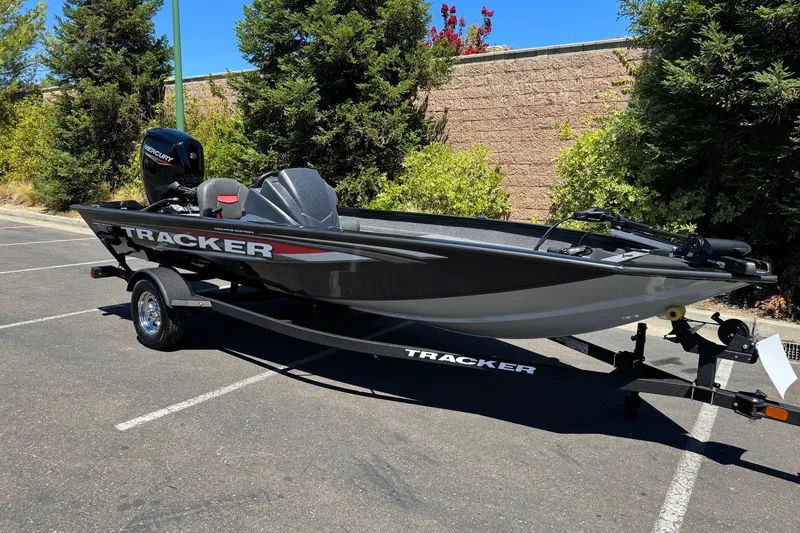 Slide: The Image of 2026 Tracker Pro Team 175 Crappie Edition boat on trailer in parking lot. - 4
