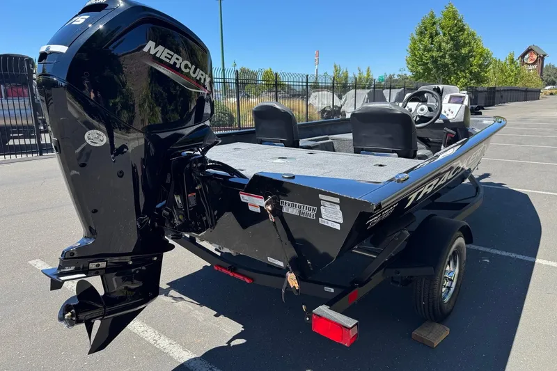 Slide: The Image of 2026 Tracker Pro Team 175 Crappie Edition boat with Mercury engine in parking lot. - 8