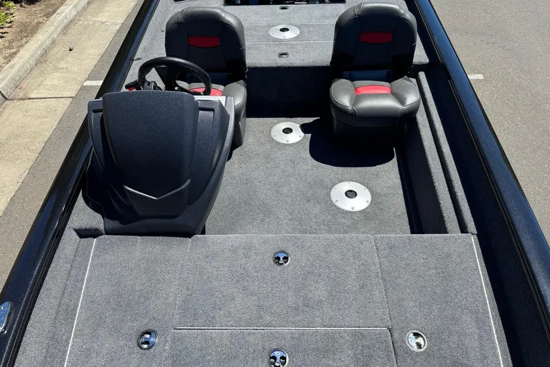 Slide: The Image of 2026 Tracker Pro Team 175 Crappie Edition boat interior with dual seats and steering console. - 11