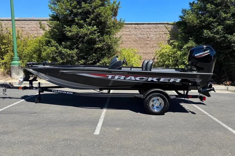Slide: The Image of 2026 Tracker Pro Team 175 Crappie Edition boat in parking lot, side view. - 3