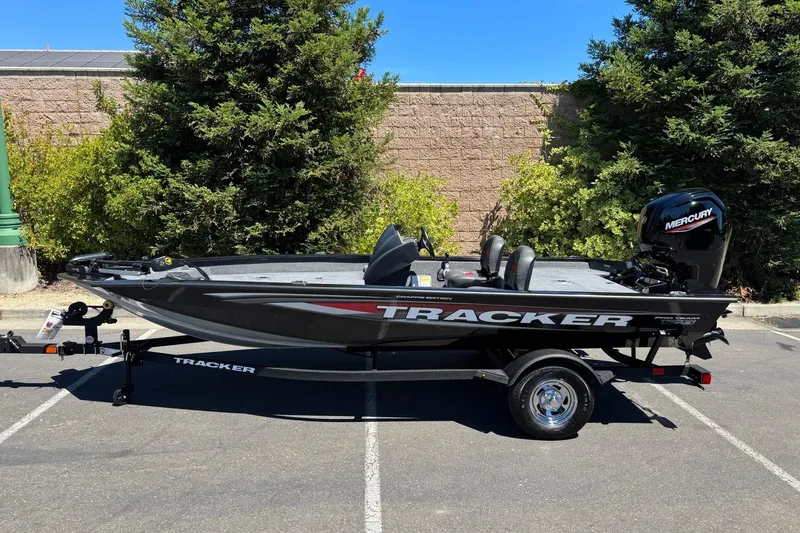 The Image of 2026 Tracker Pro Team 175 Crappie Edition boat on trailer, parked outdoors. - 0