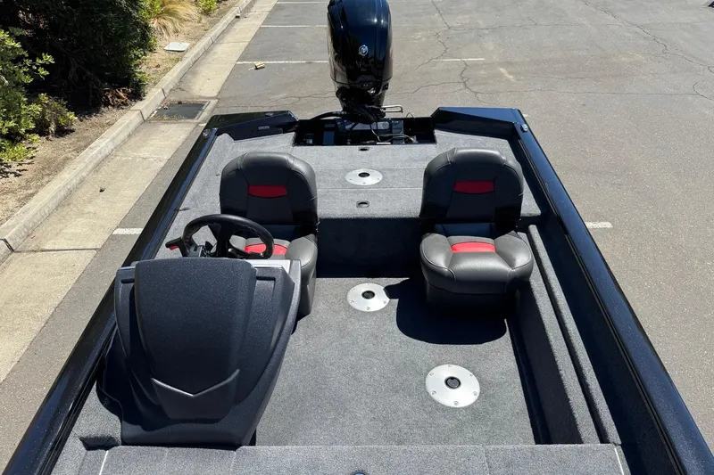 Slide: The Image of 2026 Tracker Pro Team 175 Crappie Edition boat interior with dual seats and steering console. - 12