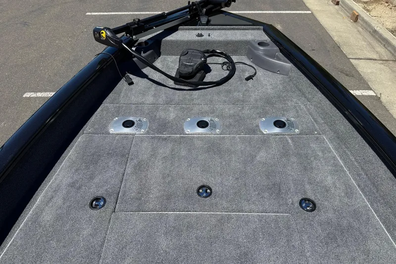 Slide: The Image of 2026 Tracker Pro Team 175 Crappie Edition boat deck with fishing rod holders. - 10