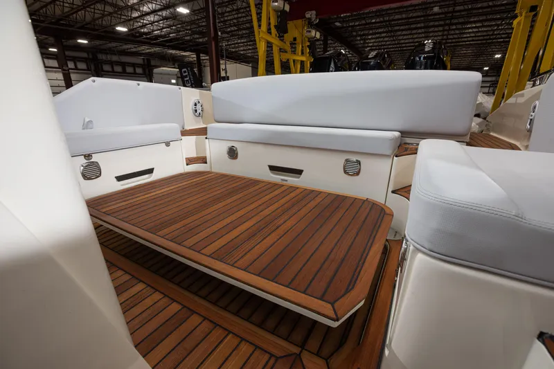 Slide: The Image of Nuova Jolly Prince 38 Sport Cabin 2025 interior with wooden deck and cushioned seating. - 19