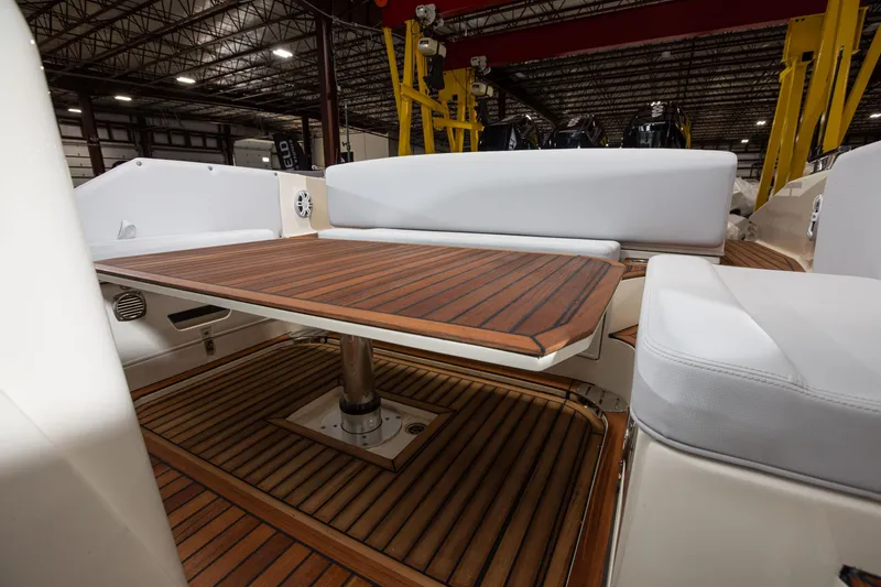 Slide: The Image of 2025 Nuova Jolly Prince 38 Sport Cabin interior with wooden table and seating. - 20