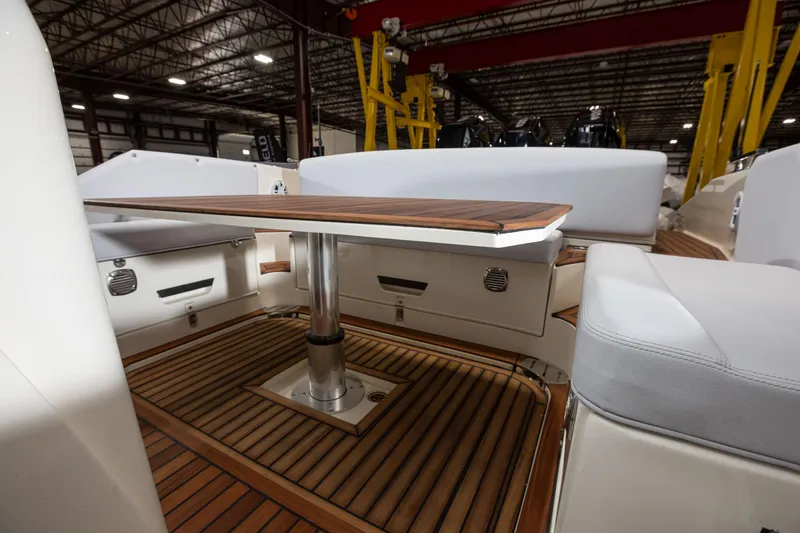 Slide: The Image of 2025 Nuova Jolly Prince 38 Sport Cabin interior with wooden table and seating. - 21