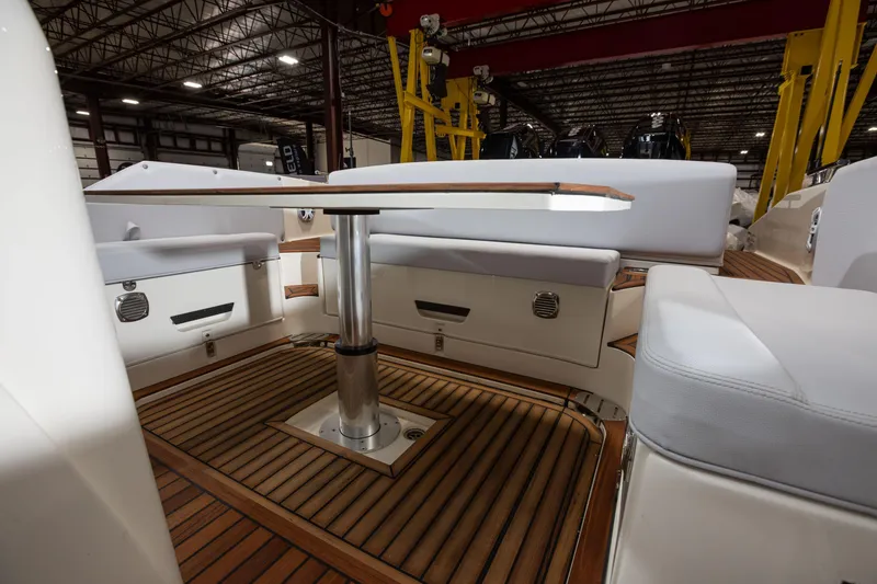 Slide: The Image of 2025 Nuova Jolly Prince 38 Sport Cabin interior with wooden deck and seating area. - 23