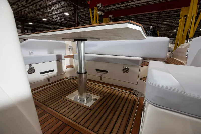 Slide: The Image of 2025 Nuova Jolly Prince 38 Sport Cabin interior with wooden flooring and cushioned seating. - 26