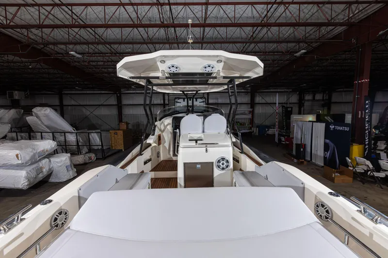Slide: The Image of 2025 Nuova Jolly Prince 38 Sport Cabin boat interior in a warehouse setting. - 4