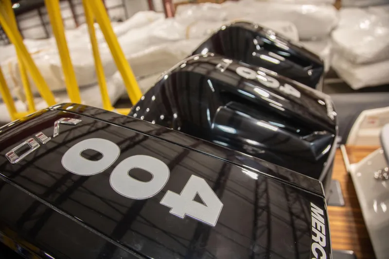 Slide: The Image of Outboard engines on a 2025 Nuova Jolly Prince 38 Sport Cabin boat in a showroom. - 5