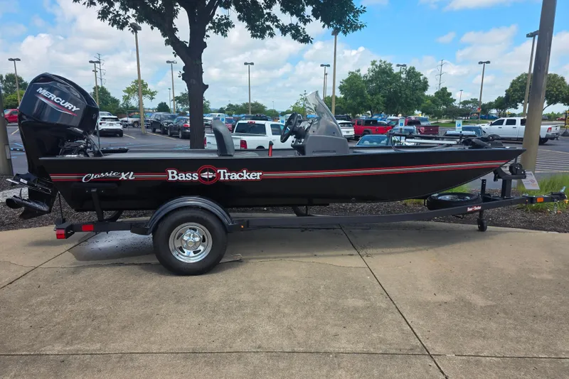 The Image of 2026 Tracker Bass Tracker Classic XL boat on trailer in parking lot. - 0