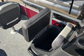 Slide: The Image of 2026 Sun Tracker Bass Buggy 18 DLX boat interior with open storage compartment and seating. - 13