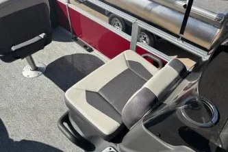 Slide: The Image of 2026 Sun Tracker Bass Buggy 18 DLX interior with cushioned seating and cup holder. - 14