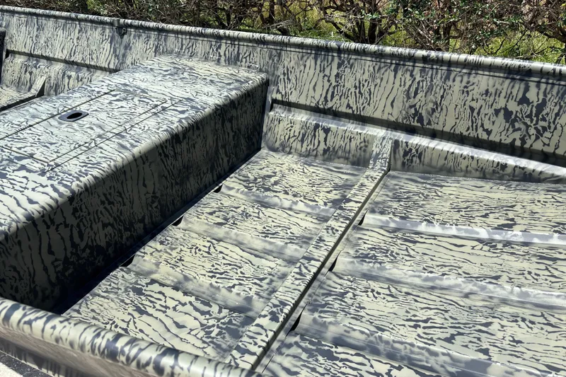 Slide: The Image of 2026 Tracker Grizzly 15 Jon boat interior with camouflage pattern. - 13