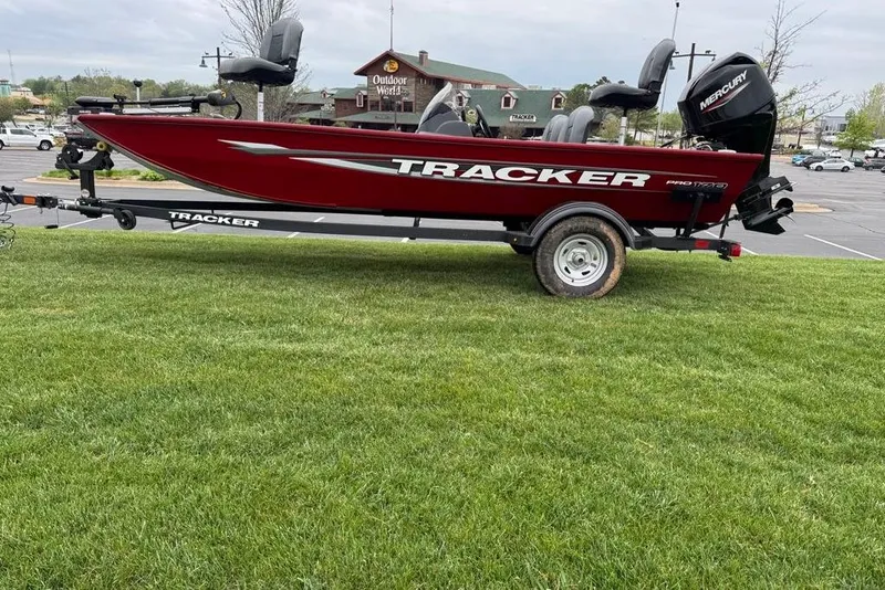 The Image of 2026 Tracker Pro 170 boat on trailer, parked on grass near Outdoor World. - 0