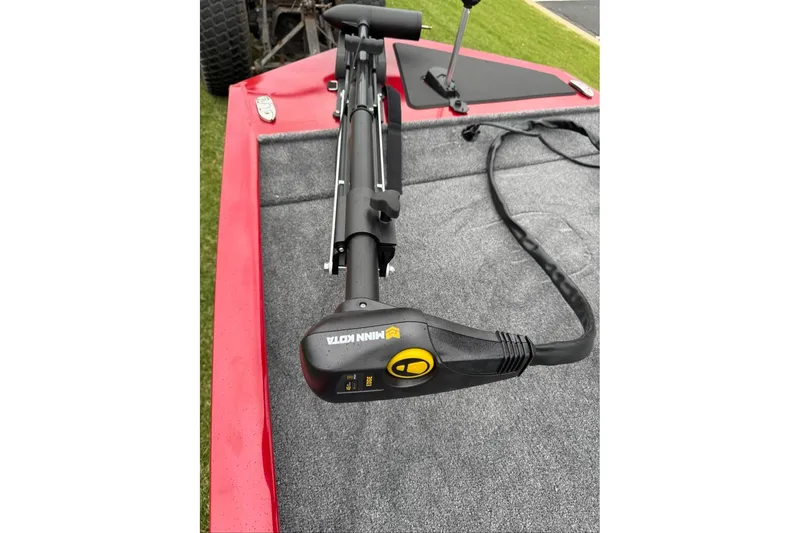 Slide: The Image of 2026 Tracker Pro 170 boat with Minn Kota trolling motor on red deck. - 10