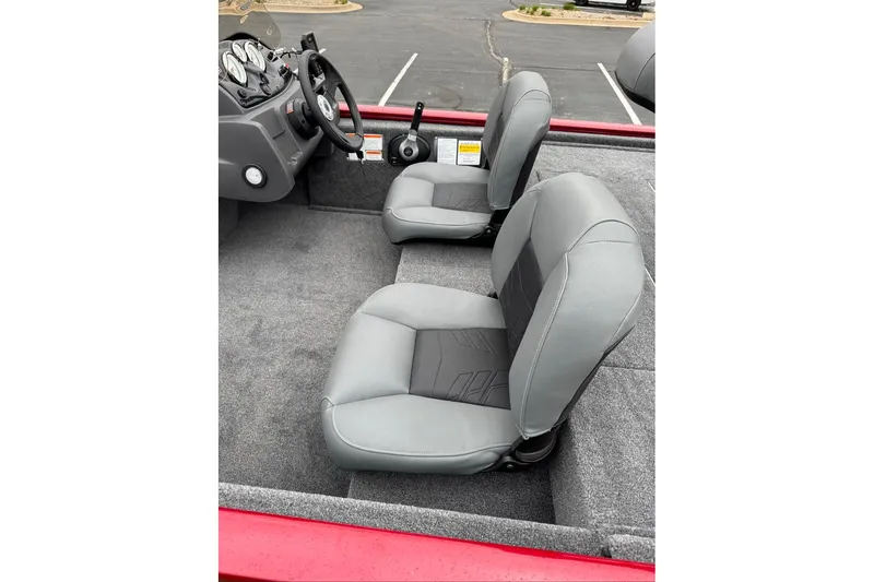 Slide: The Image of 2026 Tracker Pro 170 boat interior with gray seats and steering wheel. - 8