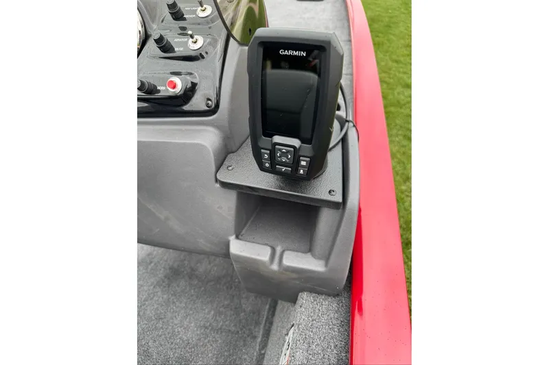 Slide: The Image of Garmin device on 2026 Tracker Pro 170 boat dashboard, featuring control panel and red trim. - 9