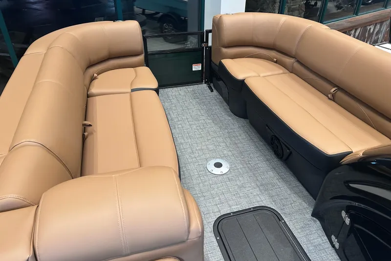 Slide: The Image of Luxurious interior of 2026 Regency 230 DL pontoon boat with tan seating. - 17