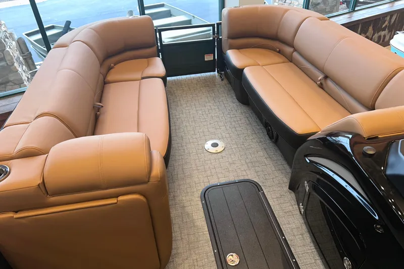 Slide: The Image of Luxurious interior of 2026 Regency 230 DL pontoon boat with tan seating and modern design. - 18