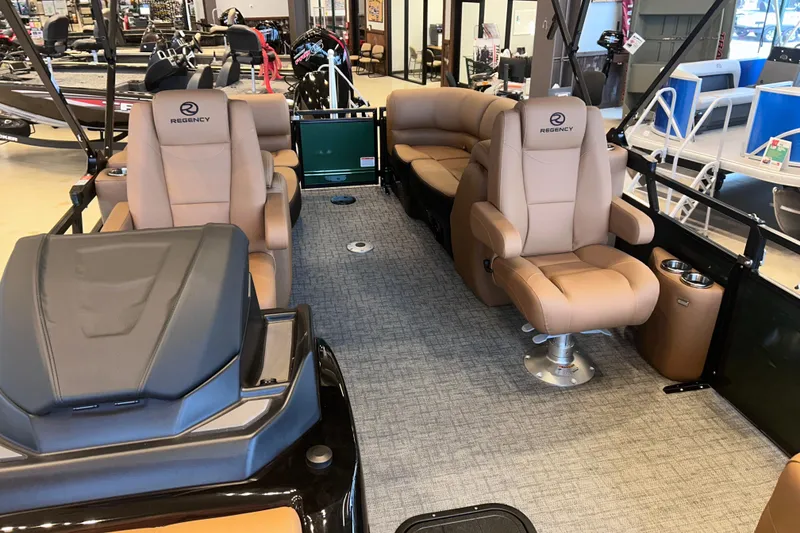 Slide: The Image of Luxurious interior of 2026 Regency 230 DL pontoon boat with plush seating and modern design. - 21