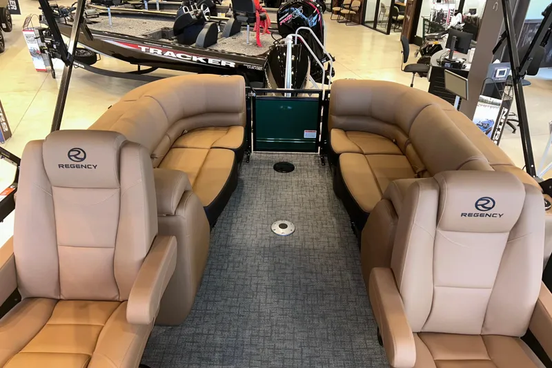 Slide: The Image of Luxurious interior of 2026 Regency 230 DL pontoon boat with plush seating. - 23