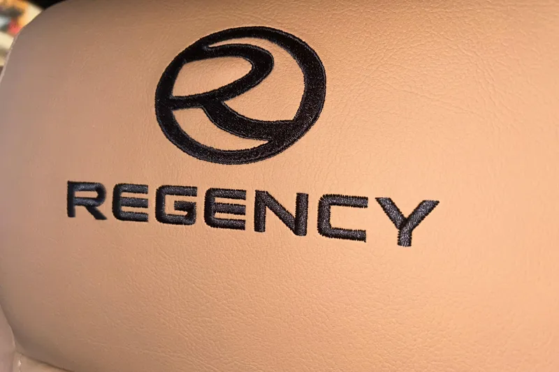 Slide: The Image of Regency 230 DL 2026 logo on beige leather upholstery. - 26