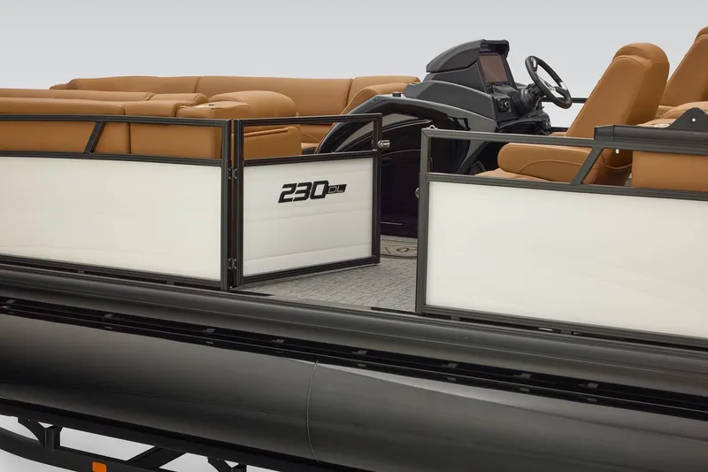 Slide: The Image of Luxurious seating inside a 2026 Regency 230 DL boat, featuring tan upholstery and spacious layout. - 37