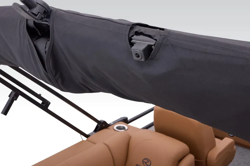 Slide: The Image of 2026 Regency 230 DL boat with covered canopy and integrated camera. - 64