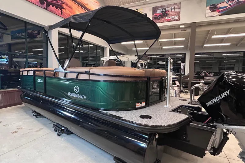 Slide: The Image of 2026 Regency 230 DL pontoon boat with Mercury engine in showroom. - 7
