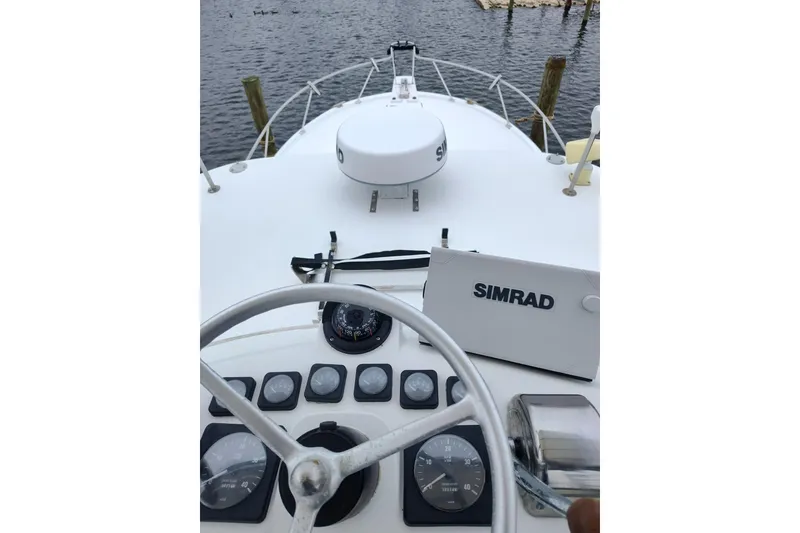 Slide: The Image of Helm of 1998 Luhrs 36 SX Open boat with Simrad navigation system. - 11
