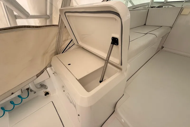 Slide: The Image of 1998 Luhrs 36 SX Open boat interior with open storage compartment and seating. - 23