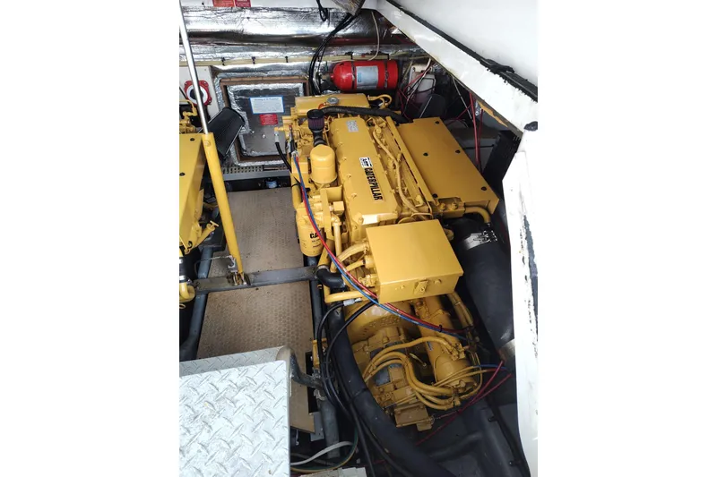 Slide: The Image of Engine room of 1998 Luhrs 36 SX Open with Caterpillar engine visible. - 28