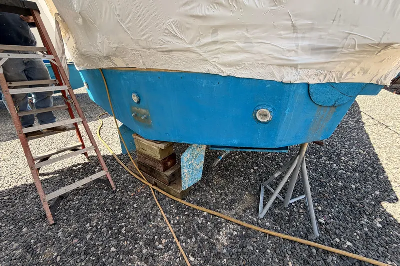 Slide: The Image of 1998 Luhrs 36 SX Open boat on blocks, undergoing maintenance. - 29