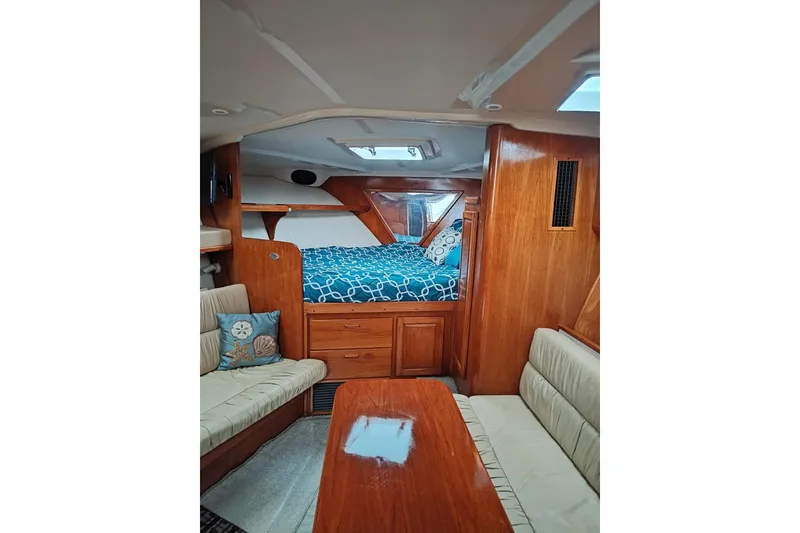 Slide: The Image of Interior of 1998 Luhrs 36 SX Open yacht with cozy seating and wooden finishes. - 5