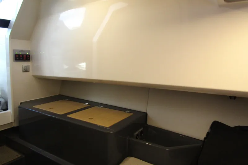 Slide: The Image of 2023 Windy SR28 CC interior cabin with sleek storage compartments. - 16