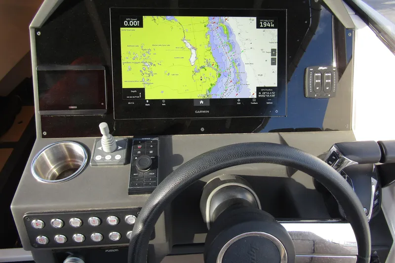 Slide: The Image of 2023 Windy SR28 CC dashboard with navigation display and controls. - 12