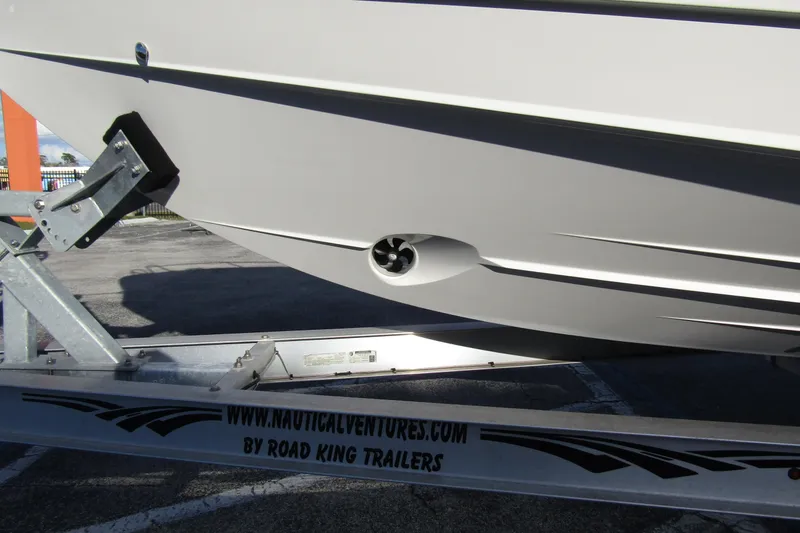 Slide: The Image of 2023 Windy SR28 CC boat on Road King trailer, side view. - 6