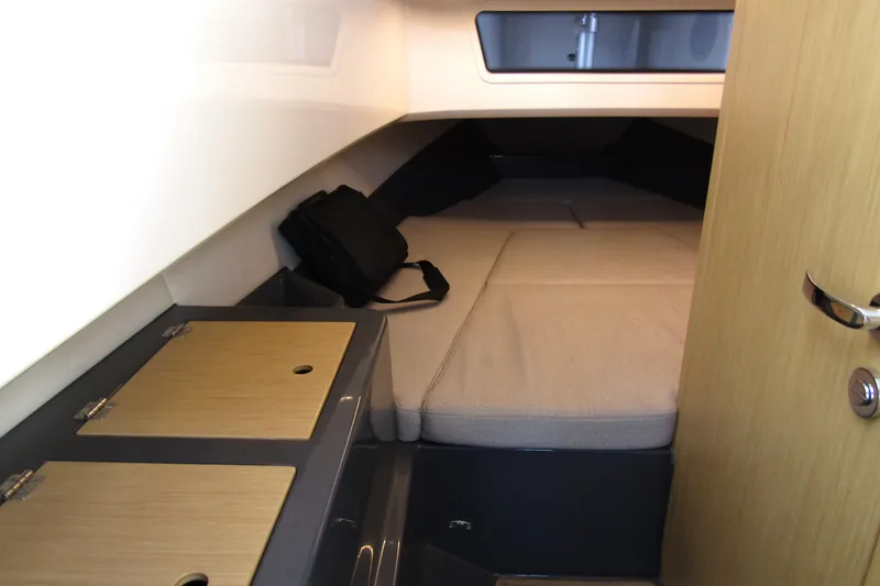 Slide: The Image of Interior cabin of 2023 Windy SR28 CC boat with cozy sleeping area. - 14