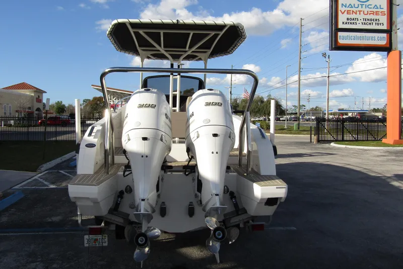 Slide: The Image of 2023 Windy SR28 CC boat with dual Yamaha 200 engines at Nautical Ventures dealership. - 2