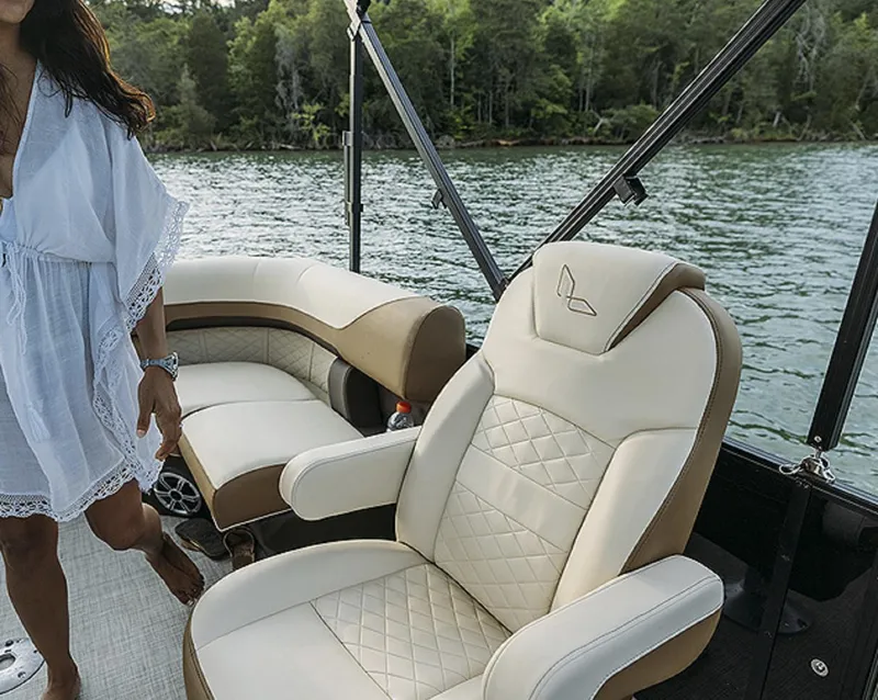 Slide: The Image of Luxurious seating on a 2025 Lowe SS230WT boat, with scenic lake view. - 11