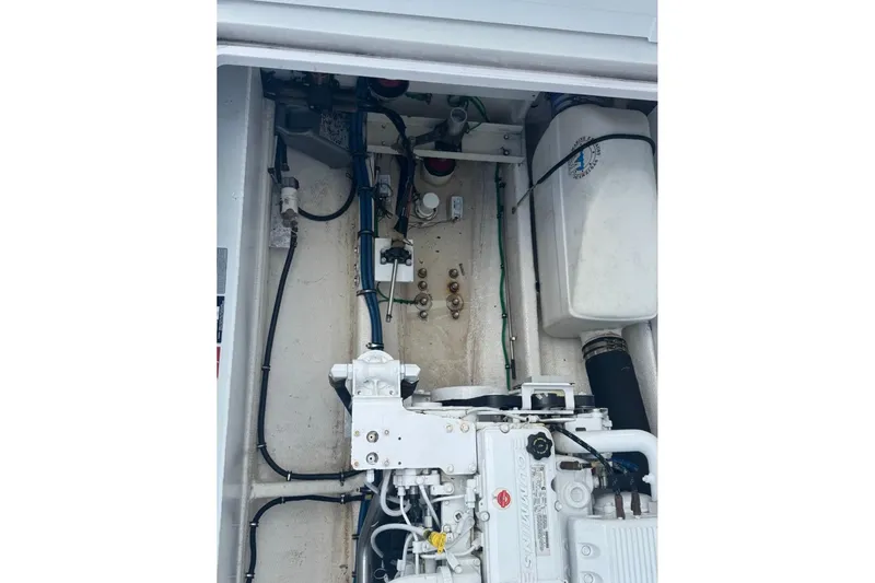 Slide: The Image of Engine compartment of a 2021 OceanPro 35 CWS boat, showcasing mechanical components. - 14