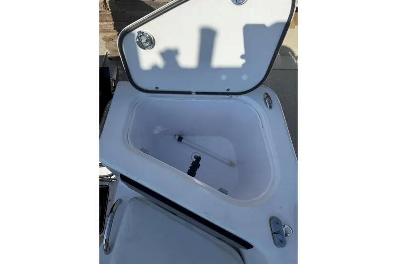 Slide: The Image of Open storage compartment on 2007 Pro-Line 20 Sport boat. - 20
