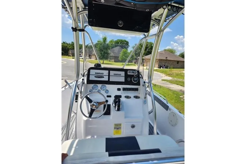 Slide: The Image of 2007 Pro-Line 20 Sport boat console with steering wheel and Simrad electronics. - 3