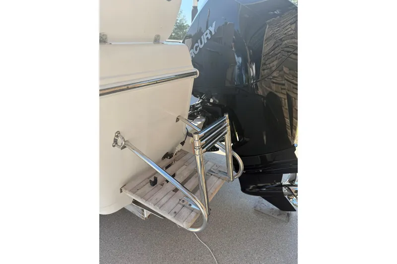 Slide: The Image of 2007 Pro-Line 20 Sport boat with Mercury engine and swim ladder. - 8